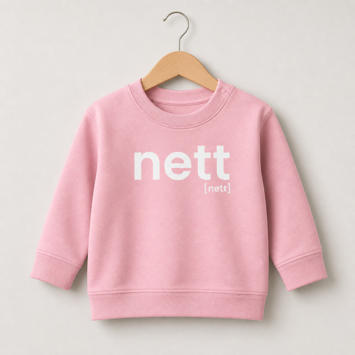 Rosafarbenes Baby Sweatshirt nett von JoisPulse, flach liegend fotografiert