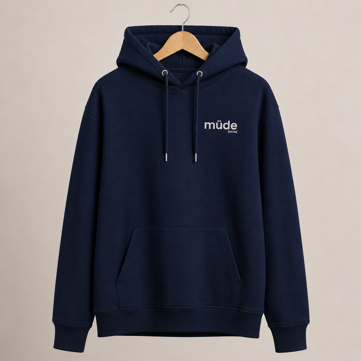Dunkelblauer Bio Hoodie müde von JoisPulse mit gesticktem Statement, flach liegend