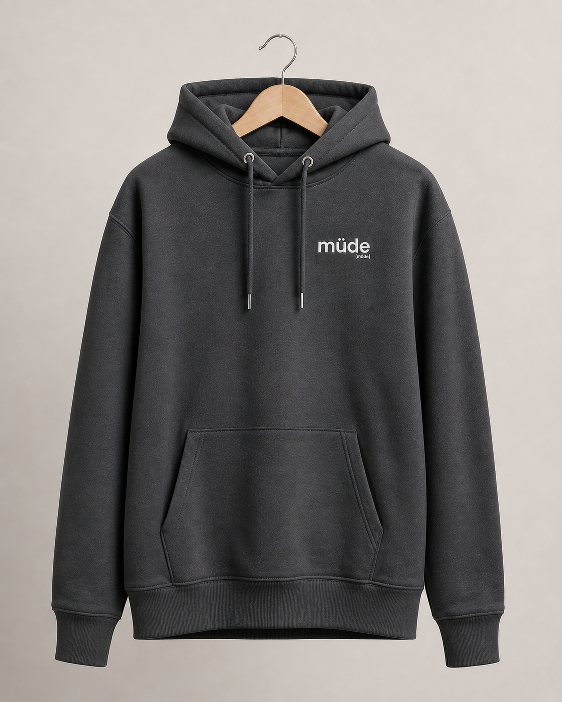 Grauer Bio Hoodie müde von JoisPulse mit gesticktem Statement, flach liegend